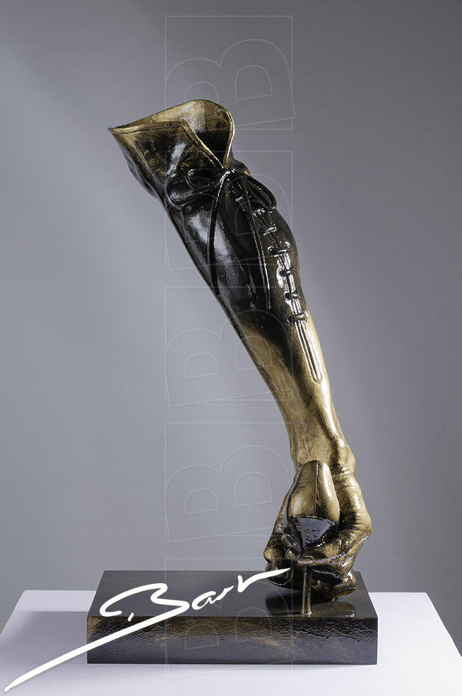 Sculpture of a boot made out of a high heeled shoe, a lady's leg and a hand