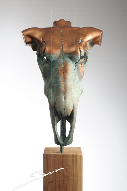 Sculpture of a skull of a bull with the appearance of the torso of a woman